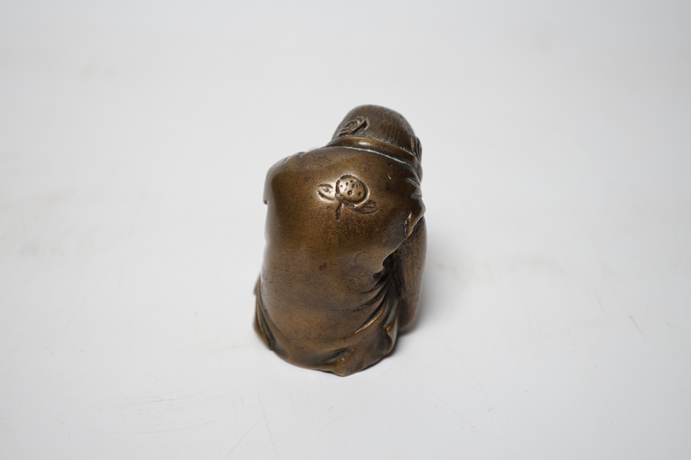 A Japanese bronze model of a monkey, 19th century, 5.5cm high